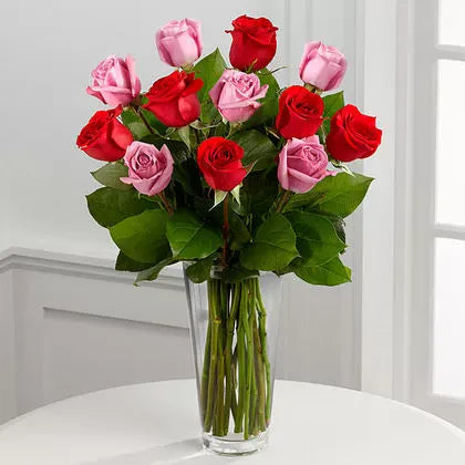 Bunch of Red and Pink Roses in a Glass Vase
