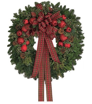 Christmas wreath with red apples, pine cones, and a plaid ribbon on a white background