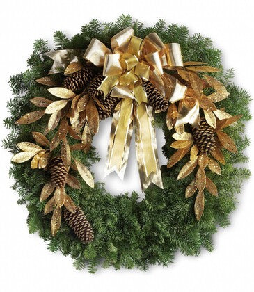 Christmas wreath with gold ribbons and pinecones on a white background
