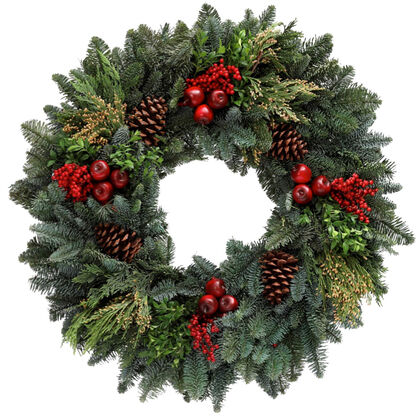 Christmas wreath with greenery, red berries, and pinecones on a white background