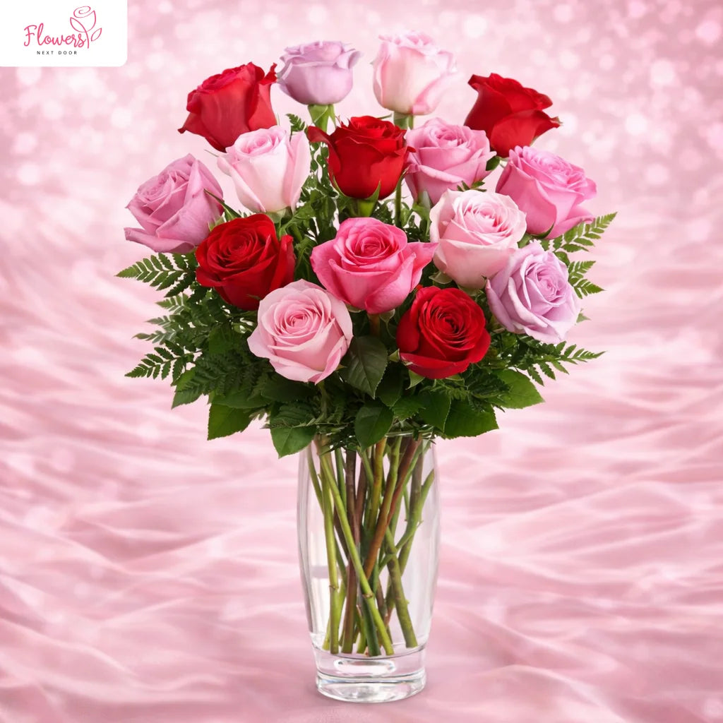 captivating mix color roses in a clear glass vase